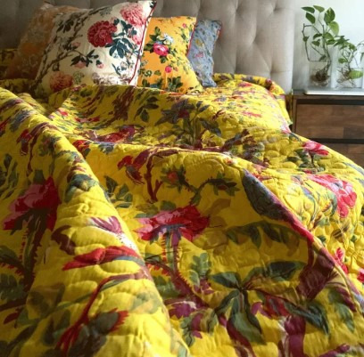 Why are quilt blankets considered both decorative and functional?