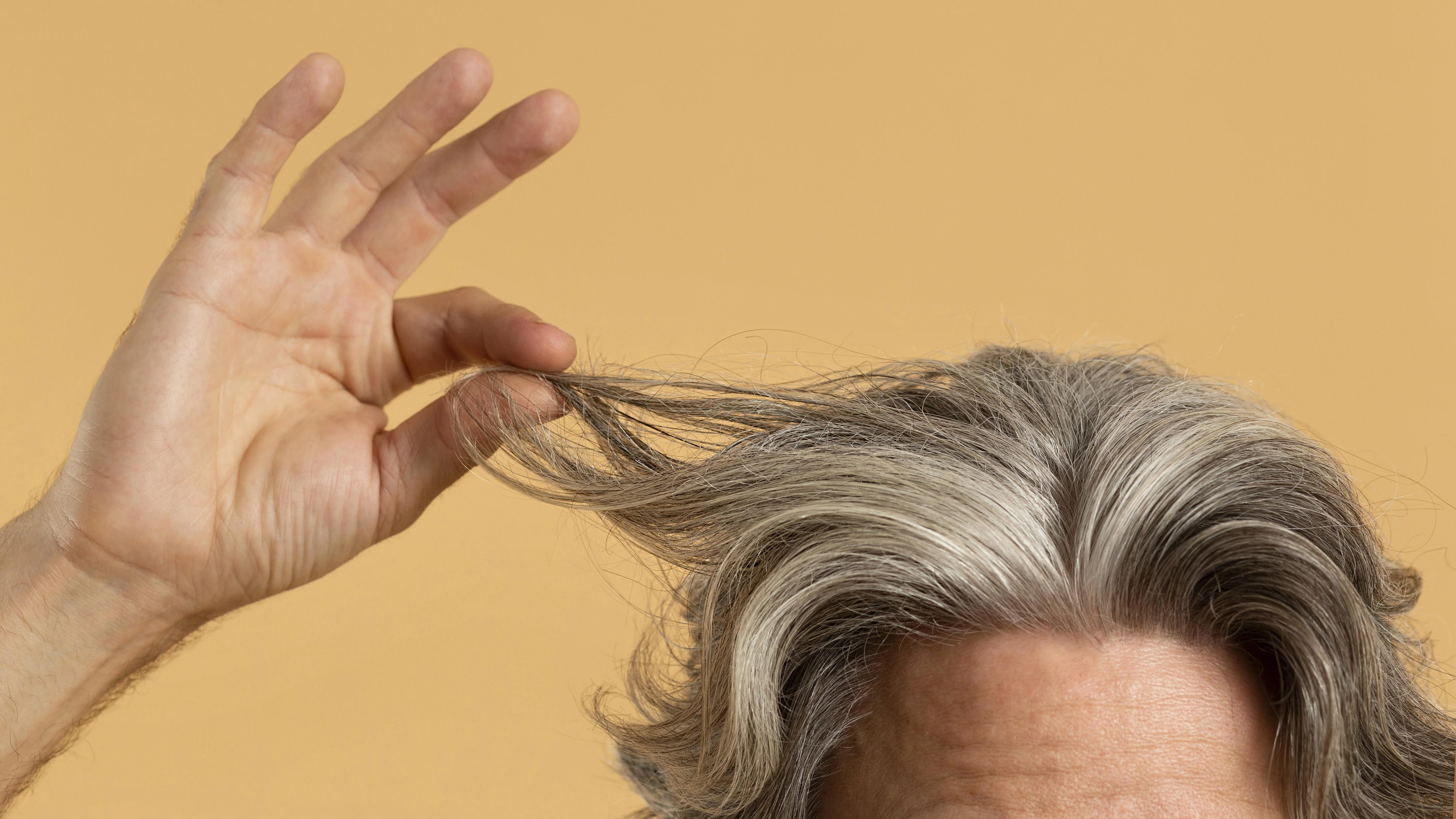 What Can I Put on My Grey Hair to Make It Look Better Naturally?